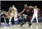  ?? MATT SLOCUM - THE ASSOCIATED PRESS ?? Sixers guard Ben Simmons, left, grabbing a loose ball under the defense of the Bulls’ Cristiano Felicio during a Feb. 9 game, has used the coronaviru­sinduced interrupti­on in the NBA season to fully heal from a back injury, general manager Elton Brand said Tuesday.