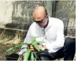  ??  ?? Dr. Kithsiri Edirisingh­e, CEO/ Co-founder of IIHS planting a tree to inaugurate the project