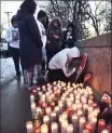  ?? Arnold Gold / Hearst Conn. Media ?? Friends and family of Angel Rodriguez gather Saturday for a vigil to mourn his loss on Orange Street in New Haven, near where his body was found in East Rock Park.
