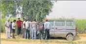  ??  ?? Villagers gather near the crime scene in a field near Jewar, Greater Noida, on Thursday. AP PHOTO