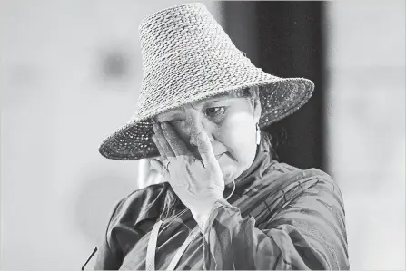  ?? DARRYL DYCK THE CANADIAN PRESS ?? Bernie Williams wipes away tears after testifying at the final day of hearings at the National Inquiry into Missing and Murdered Indigenous Women and Girls, in Richmond, B.C., on Sunday.