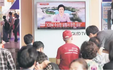  ?? — Reuters photo ?? People watch a TV news report about North Korea’s hydrogen bomb test at a railway station in Seoul, South Korea in this file photo.