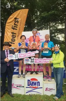  ??  ?? The presentati­on of prizes to the winners of the Dawn Milk Killarney Women’s Mini Marathon in Killarney on Saturday. Pictured are (from left) Declan Sheehan, Sales Manager, Dawn Milk; Geraldine O’Shea, Bantry (2nd place); Deidre Harrington, Bantry (1st...