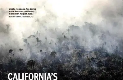  ?? LEONARDO CARRATO / BLOOMBERG, FILE ?? Smoke rises as a fire burns in the Amazon rainforest in Brazil in August 2019.