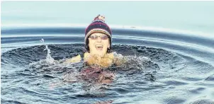  ?? SUBMITTED PHOTO ?? For the past 25 years Debbie Olson has ben celebratin­g the beginning of a new year with a polar plunge, including this one at the beginning of 2017 in the icy waters near Pasadena, N.L.