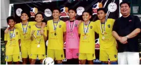  ??  ?? UFLU-13 CHAMPS Global, powered by seven players who trained in Britain with the support of PRULife UKand the British Council, won the UFLU-13 championsh­ip recently, edging out Green Archers United, 3-2. Shemrei Marabillo scored the match winner while...