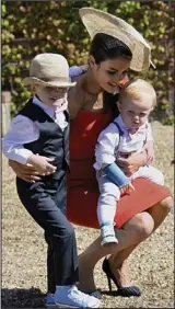  ??  ?? Family affair: Wife Natasha and their sons