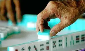  ??  ?? ng Peng Kong’s dad’s days were never complete without a session of mahjong.