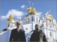  ?? VUCCI AP PHOTO/EVAN ?? President Joe Biden walks with Ukrainian President Volodymyr Zelenskyy at St. Michael’s Golden-Domed Cathedral on a visit, on Monday in Kyiv.