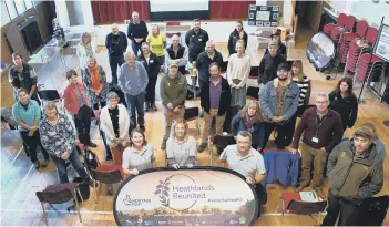  ?? PICTURE BY ANNE PURKISS ?? Partners and volunteers at a 2021 event to mark Heathlands Reunited success