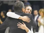  ?? Jessica Hill / Associated Press ?? UConn’s Kia Nurse hugs coach Geno Auriemma during a Senior Night ceremony before Monday night’s game against South Florida in Storrs.