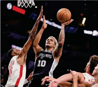  ?? Ronald Cortes/Getty Images ?? Jeremy Sochan scored 14 points in the Spurs’ overtime victory Friday night at Frost Bank Center, and none of them bigger than the last two, from a pair of on-the-mark free throws.