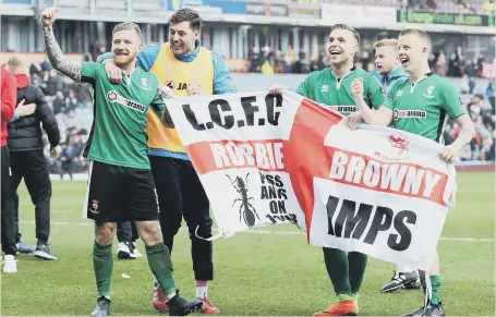  ??  ?? Lincoln City celebrate Saturday’s stunning FA Cup fifth round victory at Premier League Burnley