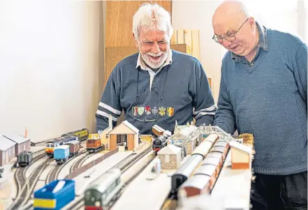  ?? Pictures by Wullie Marr. ?? HERITAGE: Volunteer guide Alistair Robertson and Jim Gibb with some of the new displays as Maud Railway Museum gets on track for a grand reopening.