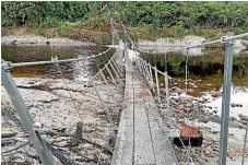  ?? EDIFICE STRUCTURES ?? The 148-metre bridge on the Heaphy Track was destroyed in a February storm, most likely by debris in the swollen Heaphy River.