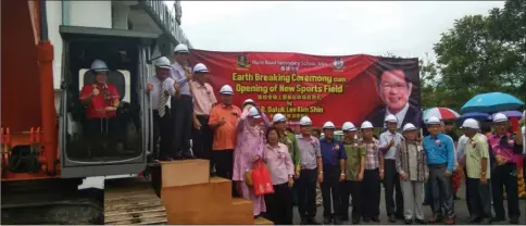  ??  ?? Lee (in excavator) launches the new building project witnessed by invited guests.