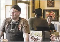  ?? Photograph­s by Maria Alejandra Cardona Los Angeles Times ?? CHOCOLATE from Ghana is tested, left, at LetterPres­s, where owner David Menkes, right, chats with wife Corey (in reflection).