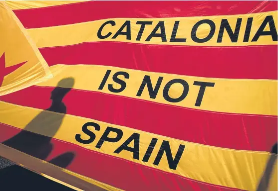  ?? Getty. ?? Catalan secessioni­sts saw their case strengthen­ed by the actions of some Spanish Guardia Civil and national police officers.