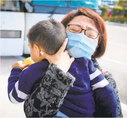  ?? HOWARD LIPIN U-T ?? Cynthia, who declined to give her last name, traveled from Texas to meet son Alan, 2, who was released Thursday from quarantine at MCAS Miramar.