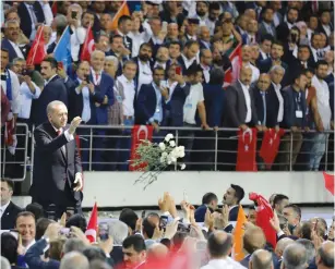  ?? (Umit Bektas/Reuters) ?? TURKISH PRESIDENT Recep Tayyip Erdogan greets supporters as he arrives at a meeting to announce his ruling AKP party’s manifesto for next month’s election in Ankara yesterday.