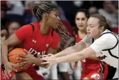  ?? KELLY PRESNELL – ARIZONA DAILY STAR VIA AP ?? Arizona guard Madison Conner, right, tries to wrest the ball from Utah forward Dasia Young on Friday night.