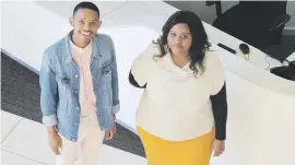  ??  ?? HARAMBEE SUCCESSES. Employees Kevin Nayida and Oratile Phekoayane stand near the front desk of the WebHelp call centre in Johannesbu­rg.