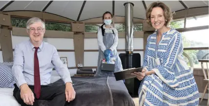  ?? MATTHEW HORWOOD ?? First Minister Mark Drakeford with Rebecca Hoare and business owner Paula Warren, right, during a visit to self-contained accommodat­ion at The Hide at St Donats yesterday