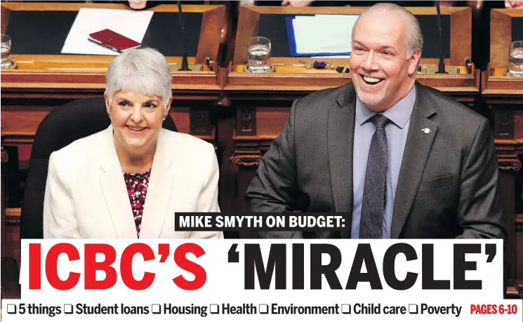  ??  ?? B.C. Finance Minister Carole James and Premier John Horgan smile before delivering the budget speech at the legislatur­e in Victoria on Tuesday afternoon. — THE CANADIAN PRESS