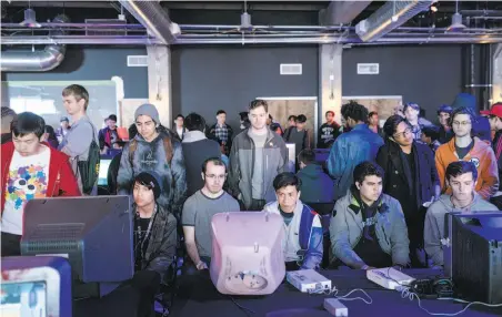  ?? Jason Henry / New York Times ?? Gamers play “Super Smash Bros.” on old monitors at the new Esports Arena — once a parking structure — in Oakland.