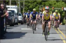  ?? PETE BANNAN – MEDIANEWS GROUP ?? Seventy-five bike riders arrive at Crozer-Chester Medical Center Wednesday as they take part in the National EMS Memorial Bike Ride to honor the lives of EMS providers who have died in the line of service.