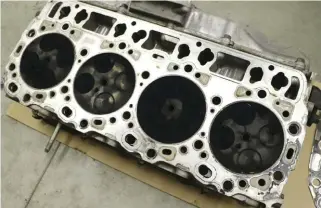  ??  ?? Upon close inspection of the cylinder heads and engine block, it appears the No. 7 cylinder had been the only one leaking. At this point, the heads will be dropped off at the local machine shop to be gone through, cleaned, tested for cracks, valves...