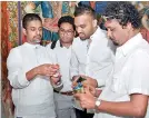  ??  ?? Arosha Perera – CEO, Leo Burnett Sri Lanka, Shivantha Rodrigo – Head of Design, JAT Paints, Richard Gunawarden­e – Head of Marketing at JAT Holdings, A. Kalum De Alwis – the artist inspecting the paints that will be used for the restoratio­n