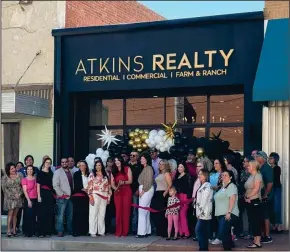  ?? Courtesy photos ?? The United Way of Big Spring and Howard County was presented with a Thank You for Your Investment banner during their annual banquet. Atkins Realty celebrated their new office location with a special ribbon cutting ceremony on Friday, March 22.