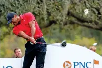  ?? KEVIN KOLCZYNSKI ASSOCIATED PRESS FILE PHOTO ?? Tiger Woods tees off during the final round of the PNC Championsh­ip on Dec. 17 in Orlando, Fla. Woods and Nike have ended their partnershi­p after 27 years.