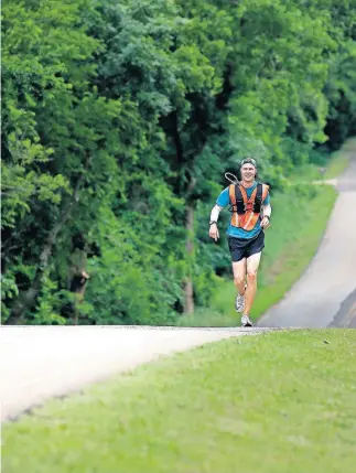  ??  ?? James Strahorn runs on North Air Depot Boulevard in Edmond on Tuesday. Strahorn, the new cross country coach at Edmond North High School, is running across Oklahoma from the Kansas border to the Texas border. [SARAH PHIPPS/ THE OKLAHOMAN]