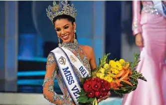 ??  ?? Thalia Olvino representa­tive of the Delta Amacuro reacts during the Miss Venezuela beauty pageant in Caracas, Venezuela.