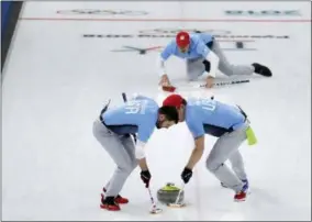  ?? THE ASSOCIATED PRESS ?? United States’ John Landsteine­r, left, and Matt Hamilton sweeps ice during the men’s curling semi-final match against Canada at the 2018 Winter Olympics in Gangneung, South Korea, Thursday. United States won.