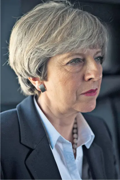  ??  ?? Uncertain future: Theresa May was facing a nervous night as exit polls pointed to her party shedding seats, rather than making gains as had been expected