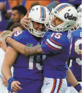  ?? John Raoux / Associated Press 2017 ?? Florida’s Johnny Townsend (left) was drafted by the Raiders, who were reported to have signed the Gators’ kicker, Eddy Pineiro (right), as a free agent.