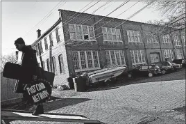  ?? [DISPATCH/ERIC ALBRECHT] ?? Chris Cope, a three-year tenant at the studio arts complex at 1199-1207 Franklin Ave., moves out his belongings from the building. Cope said he and other residents of the building received only a 24 hour notice to vacate the premises.