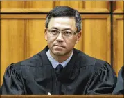  ?? GEORGE LEE / HONOLULU STAR-ADVERTISER 2015 ?? An order Friday by U.S. District Judge Derrick Watson expanded the list of family relationsh­ips by which people from six mostly Muslim countries can avoid the U.S. travel ban.