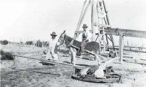  ?? COURTESY OF HUMAN SYSTEMS RESEARCH AND WSMR ?? ABOVE: Burro drawing water at the Tucker ranch, circa 1930.