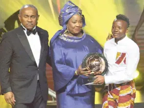  ?? EPA ?? Banyana Banyana player Chrestinah Thembi Kgatlana, far right, received the Women’s Player of the Year award from Fifa secretary-general Fatma Samoura, centre, while Confederat­ion of African Football (CAF) president Ahmad Ahmad looked on, during the CAF awards at the Abdou Diouf Internatio­nal Conference Centre in Dakar, Senegal. Kgatlana also won the Best Goal award. |