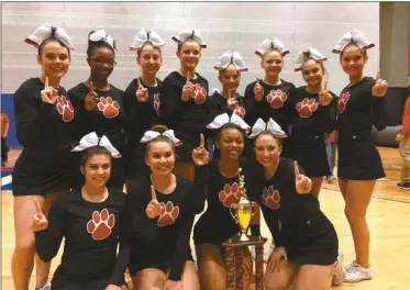  ??  ?? The Cedartown competitio­n cheer squad shows off their region trophy after Saturday’s winning performanc­e. Back from left to right are: Halee Blackmon, Khristyle Walton, Baylee Davenport, Chloe Lee, Lauren Lindsey, Lizzie Lee, Grayson Smith and Maddie Allred. Front left to right are: Bren Lewis, Emily Pruitt, Kiersten Pace, Gabbie Ramos