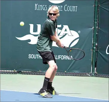  ?? VICKY SHEA / FOR TEHACHAPI NEWS ?? LEFT: Calvin Hibbard looks to return a shot with his backhand in the CIF South Area Tournament held earlier this season. Hibbard, only a freshman, made the CIF Central Section Top 16 in singles.