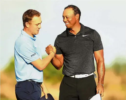  ??  ?? Nice to have
you back: Justin Thomas (left) shaking hands with Tiger Woods during the first round of the Hero World Challenge at the Albany Golf Club in the Bahamas last week.