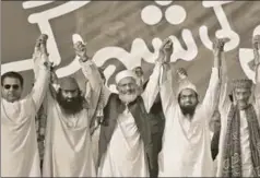  ?? AFP ?? 26/11 mastermind Hafiz Saeed (second from right) has recently floated a political party (Mili Muslim League) to participat­e in Pakistan’s general elections due this month