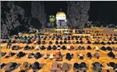  ?? AFP ?? Palestinia­ns perform the dawn prayer inside the al-Aqsa mosque compound, in Jerusalem's Old City.