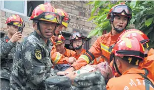  ?? REUTERS ?? Rescue workers carry an injured man on a stretcher yesterday after earthquake­s hit Changning county in Yibin, Sichuan province on Monday.