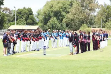 ??  ?? Both teams, alongside the Warragul and Bairnsdale GCL sides, stand in solidarity in a minute silence to remember Jean-Paul D’Amico in a tribute match last Sunday.